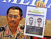 Indonesian police spokesman Nanan Sukarna shows a sketch of the JW Marriott and Ritz-Carlton hotel suicide bombers.