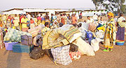 Returnees sorting out their luggages on Tuesday at Gicumbi transit camp. (Photo: A. Gahene)