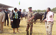 RRA Commissioner General Mary Baine in the company of RDF Brig.General Eric Murokore and other officials handing over the RRA donations (Photo A. Gahene).