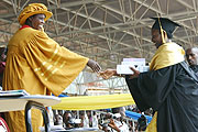 WELL DONE: Former Minister of Education, Dr. Daphrose Gahakwa congratulates one of the best students at the first graduation of INILAK yesterday. (Photo Freddy Goodman)