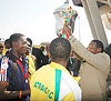 Atraco club chairman Col. Ludovic Twahirwa Dodo carries high the Kagame Cup trophy.