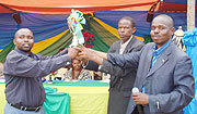 L-R Celestine Twagirumukiza, Mayor of Ruhango, Michel Mbarubukeye, the Kamonyi village head and Sosthene Habimana, the sector leader at the ceremony. (Photo D Sabiiti)