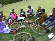 Participants take notes duringa a training session on Cassava cultivation.