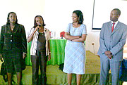 Jack Kayonga with representatives of the rewarded MFIs. (Photo B. Namata)