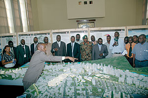 Marcel Munyaneza in charge of Urban Planning in KCC explains the Nyarugenge District Master Plan prepared by SCE Surbana on Friday ( Photo by Goodman)