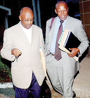 Senators Joseph Karemera (R) and Chrisologue Kubwimana leave the Senate building after Tuesdayu2019s session. (Photo J. Mbanda)