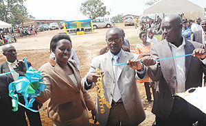 State Minister for Primary and secondary Education ( c ), Mathias Harebamungu , Kigali City Mayor Aisa Kirabo and Kicukiro District Mayor Paul Jules Ndamage  officially open classrooms for the nine year basic education in Kicukiro District. (Photo/ J. Mba