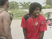 A crying Togo national team captain Emmanuel Adebayor, with unidentified team members, Friday.(Net photo)