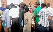 Students go through the lists of names at SFAR offices yesterday. (Photo J. Mbanda)