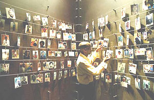 Pictures of those who died in the 1994 Genocide against the Tutsi at the Gisozi Memorial Center. Victoire Ingabire Umuhoza is accused of touting the double-genocide theory