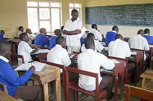 A teacher conducts lessons to a handful of students at GS de La Salle on Wednesday. (Photo: A.Gahene)