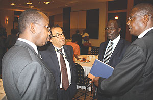 Gara (left) listens to Sam Nkusi of Altech Stream (right) while Khaled Mikkawi and Andrew Rugege both of MTN look on. (Photo/ D. K. Musoke)