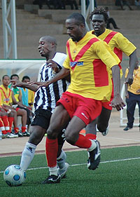 Kabange Twite (L) battles for the ball with St. Georgeu2019s defender