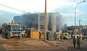 Smoke billows from the ruins of B-Club yesterday as fire-fighters try to contain it. (Photo/ F. Goodman)