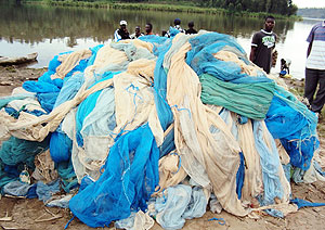 A heap of some of the illegal fishing nets before authorities set them ablaze in Kanjongo sector in Nyamasheke district. (Photo: S. Mugisha)