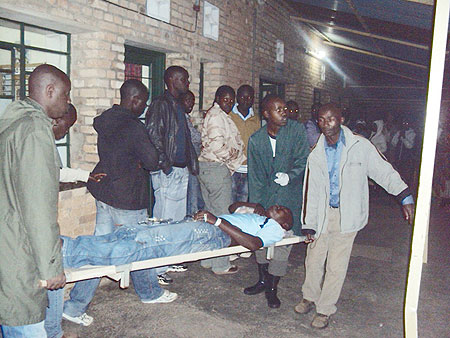 Good Samaritans lending a helping hand during evacuation of the injured to hospital. (Photo: D. Sabiiti)