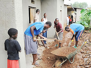 Youth from Evangelical Restoration Church during the renovation of the widows_ houses in Kimironko.