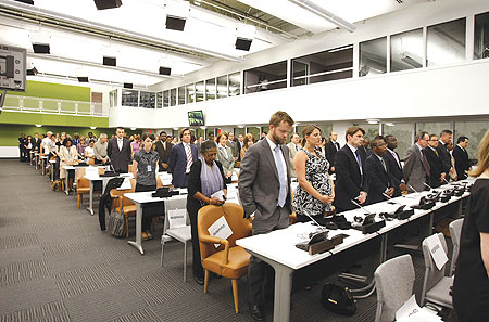 Participants standing to honour 1994 Genocide victims at the 16th commemoration ceremony in New York. (Courtsey Photo)