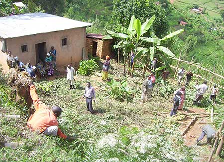 NEC sector officials and residents of Ruyaga village offered  support to  a survivor by cultivating  land to grow vegetables. (Photo: A. Gahene)