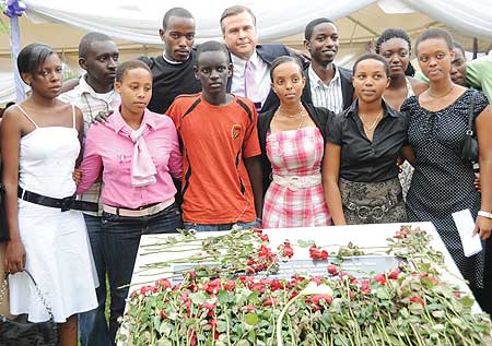 US Ambassador to Rwanda Stuart Symington takes a photo with families of former US Embassy employees who perished in the 1994 Genocide  at the US Embassy. (Photo J Mbanda)