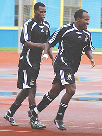 Rogba (R) being congratulated by Rassou after scoring for APR in a recent league game at Amahoro Stadium. The midfielder has earned a debut call-up on the national team. (File Photo)