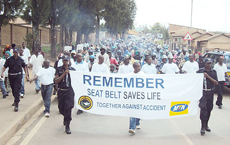 Residents join police to mark the 10th anniversary in Muhanga district. 