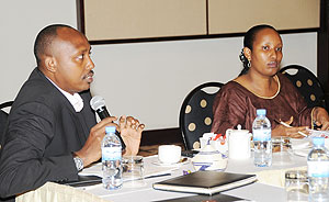 Permanent Secretaries Ernest Ruzindaza (Agriculture) and Alpha Mirembe (Cabinet Affairs) at the PSu2019 meeting yesterday. (Photo J Mbanda)