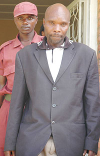 IN THE DOCK; Bernard Mukingo being escorted by the security personnel to the court (Photo; F. Goodman)