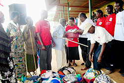 The vulnerable recieve an assortment of materials from the Red Cross. (Photo: J.C Gakwaya)