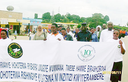 Ruhango students join Police and local leaders in a peaceful march against gender based violence. (Photo: D. Sabiiti)