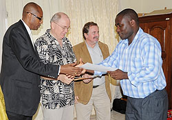 One of the trainees being awarded a certificate after completeing a Biomedical equipment technology training. (Photo J Mbanda)