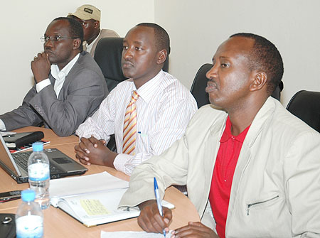 Rwanda Journalistsu2019 Associationu2019s Gaspard Safari, Patrice Mulama of MHC and MININFOR Director General Ignatius Kabagambe during the meeting yesterday (Photo F Goodman)