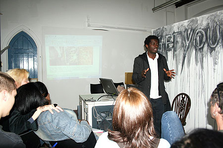 Sekajugo addressing a group of artists at Essex University, England