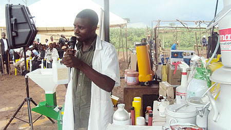 Raula Ndikumana showcasing farm inputs from his shop during the trade show. (Photo: S. Rwembeho)