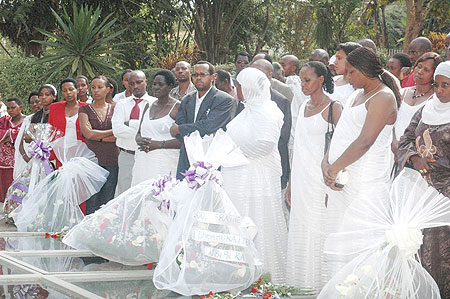 Members of COCOPHAR hold a minute of silence at Kigali Genocide Memorial Center in memory of the 1994 Genocide victims. (Photo: F. Goodman)