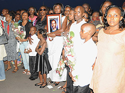 Families of the fallen peacekeepers at Kigali International Airport yesterday (Photo; F. Goodman)