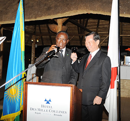 Eugene Munyakayanza the Permanent Secretary Ministry of Foreign Affairs toasting with Amb. Kunio Hatanaka the Japanese Ambassador to Rwanda during the launch of the Japanese Embassy (Photo: F. Goodman)