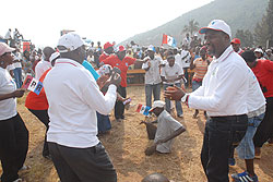 Wellars Gasamagera one of the RPF campaign committee members leads supporters in celebrations during the campaign launch in Nyarugenge district yesterday (Photo F Goodman)