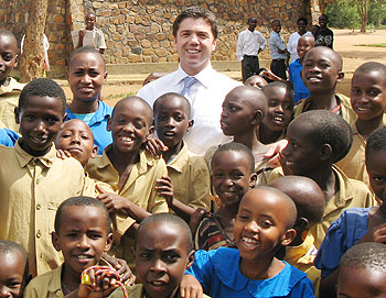 British MP, Stephen Crabb, with Primary school children in  2007 in Kigali (Courtesy photo)