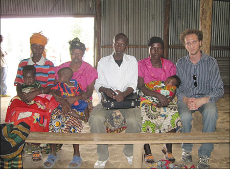 The writer and Jeremy Danneman posing with the mothers inside Mutobo Demobilisation Center