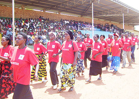 Red Cross volunteers march past guests at Gicumbi stadium yesterday (Photo A.Gahene)