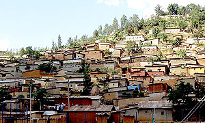 A typical slum setting with semi-permanent houses in the outskirts of Kigali City.