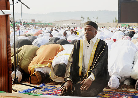 Sheikh Saleh Habimana, the head of the Muslim community, leading prayers at Nyamirambo Regional Stadium during Eid-elu2013Fitr on Friday