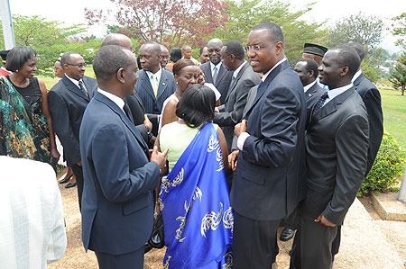 Ministers gather outside Parliament after being sworn-in on Thursday. (Photo J Mbanda)