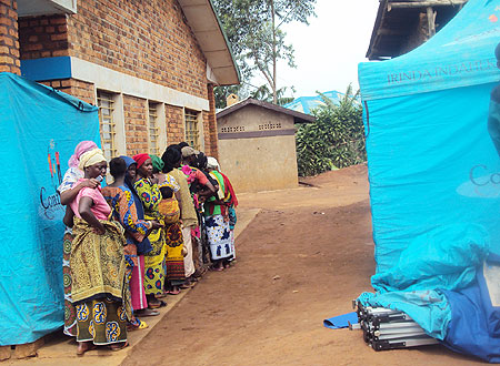 Rural residents lining up  for the new testing  and counseling services. Photo by S. Rwembeho.