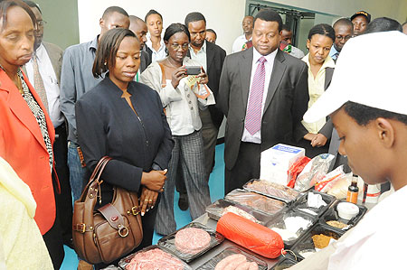 The Minister of Trade, Monique Nsazabaganwa, being shown around the facility (Photo; T. Kisambira) 