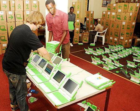 Technicians assemble Laptops for distribution in Primary schools on Tuesday. (Photo T Kisambira)