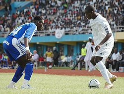 APRu2019s Abbas  Rassou (R) teases Maranathau2019s Amatepe Kodjo at Amahoro stadium in CAF Champions League game three years ago. Rassou scored a penalty as APR won 1-0 against Amagaju. (File photo)