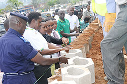 Mayor Aisa Kirabo Kacyira with Regional Police Commander, Rogers Rutikanga, during the launch of the campaign yesterday on Airport road (Photo; J. Mbanda)