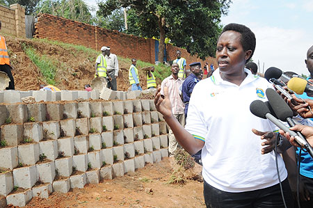 Kigali City Mayor Aisa Kirabo explains to the media about the retaining wall being constructed along Kanombe -Remera highway. (Photo J Mbanda)